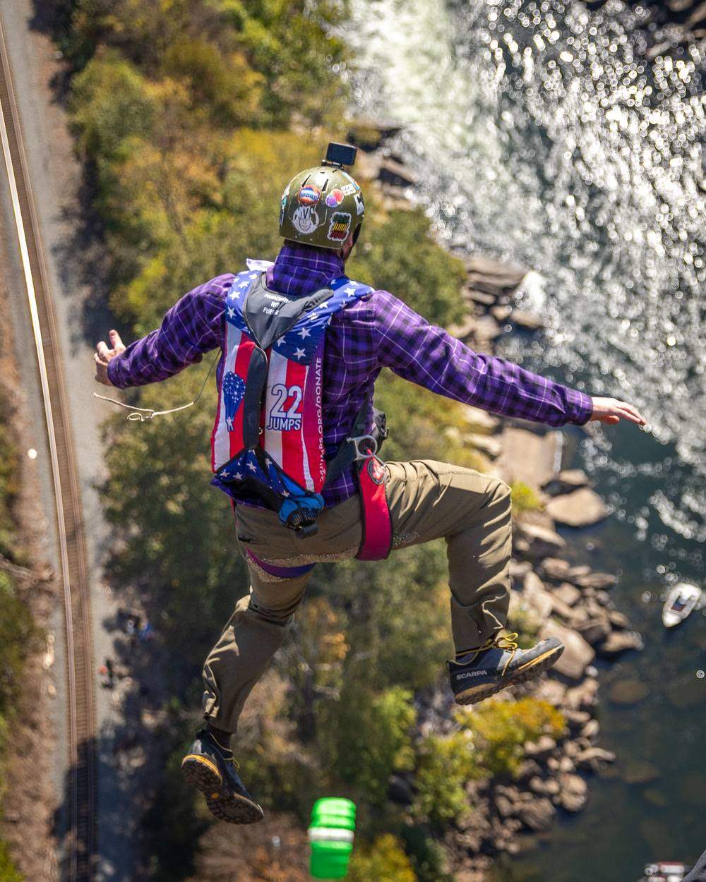 A 22 Jumps jumper exits the New River Gorge Bridge on Bridge Day