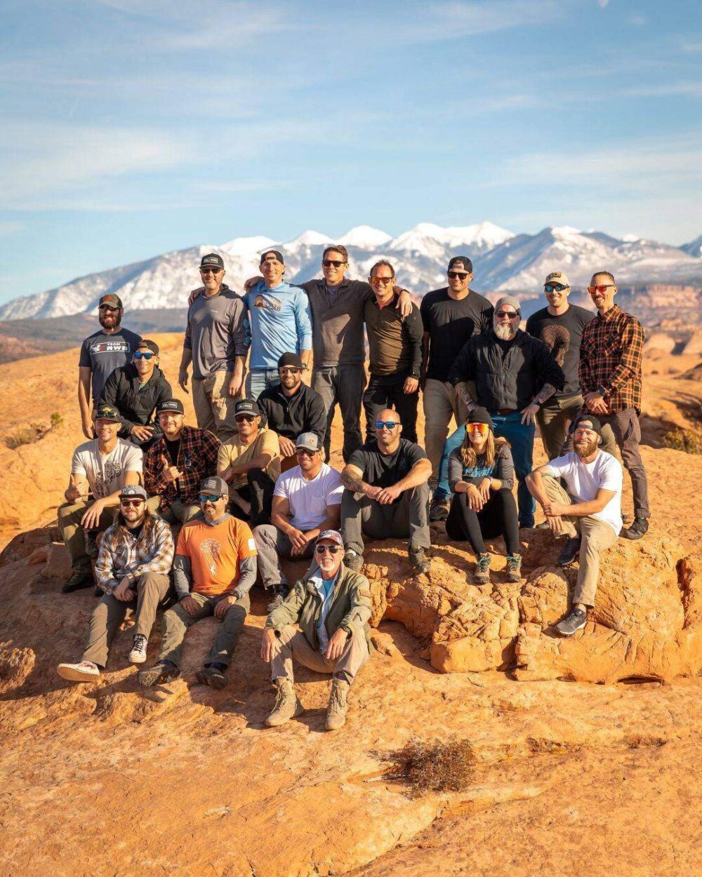 Veterans hiking together on slickrock at the Moab retreat